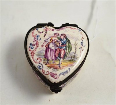 Lot 333 - An enamel heart-shaped patch box, decorated with a courting couple, marked underneath 'Lille 1707'