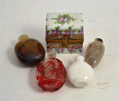 Lot 334 - Four Chinese 19th century snuff bottles and one porcelain box