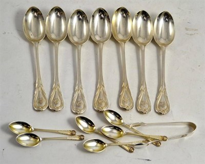 Lot 340 - A pair of silver sugar tongs, a set of six silver coffee spoons and seven silver teaspoons