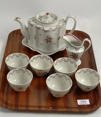 Lot 354 - A Newhall porcelain tea service comprising tea pot and stand, six tea bowls and cream jug