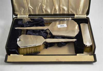 Lot 365 - A cased silver backed brush set