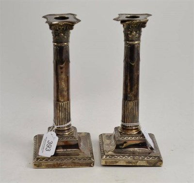 Lot 393 - Pair of silver column candlesticks