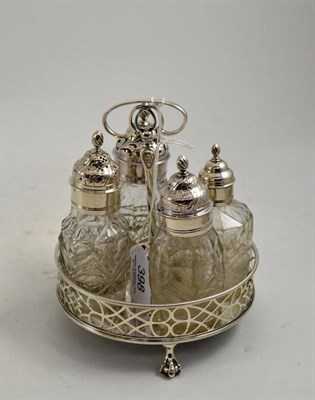 Lot 398 - A George III silver cruet stand, E*A, London 1763 with pierced border and three claw feet with four