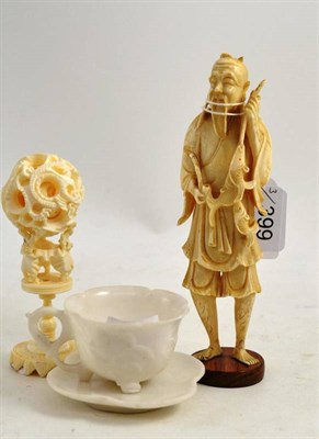 Lot 399 - Japanese ivory fisherman, Chinese ivory puzzle ball on stand and Chinese white cup and saucer