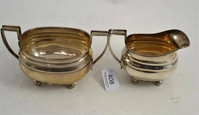 Lot 408 - A silver milk jug and sugar basin, Birmingham 1934 and Sheffield 1935