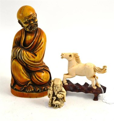 Lot 410 - A Chinese ivory horse on wooden stand and two composite figures of deities