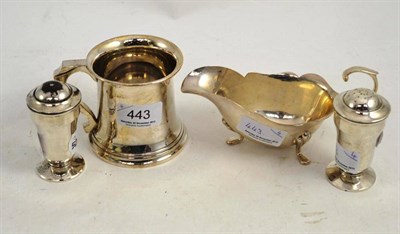 Lot 443 - A silver mug, a silver sauce boat, salt and pepper