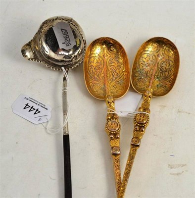 Lot 444 - A pair of silver gilt ";Anointing"; serving spoons, London 1901 and a silver toddy ladle with...