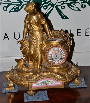 Lot 471 - A late 19th century French gilt metal porcelain mantel clock