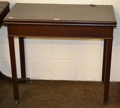 Lot 535 - A mahogany fold over tea table