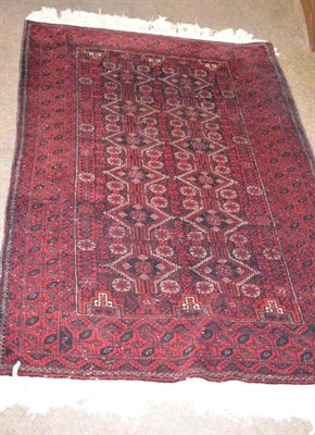 Lot 537 - Balouch rug, Persian/Afghan Frontier, the field with two columns of stepped guls enclosed by...