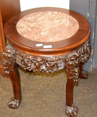 Lot 538 - A Chinese carved hardwood stand with marble top