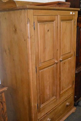 Lot 547 - A small pine wardrobe