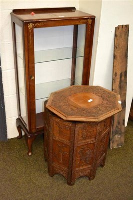 Lot 550 - A carved Eastern table and a walnut cabinet