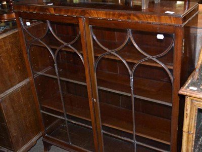 Lot 552 - A glazed mahogany display cabinet with astragal moulding and splayed bracket feet