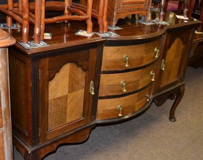 Lot 559 - A walnut bow fronted sideboard