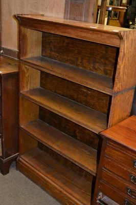 Lot 570 - An oak four height open bookcase