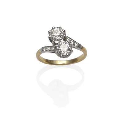 Lot 234 - A Diamond Two Stone Twist Ring, circa 1930, two old cut diamonds in white claw settings, with...
