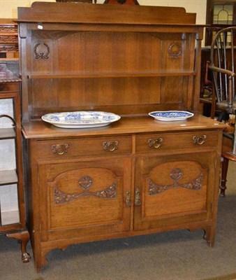 Lot 577 - An Arts & Crafts oak dresser