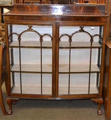 Lot 578 - A mahogany glazed china cabinet on claw and ball feet