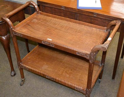 Lot 581 - A mahogany tea trolley with dragon carved decoration