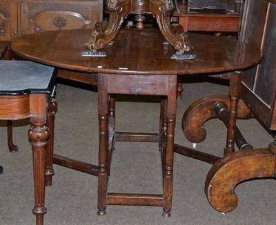 Lot 585 - An 18th century oak gate leg table