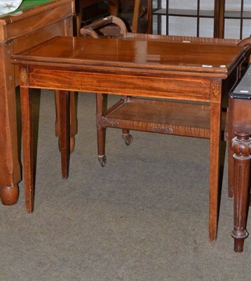 Lot 586 - A mahogany fold over tea table