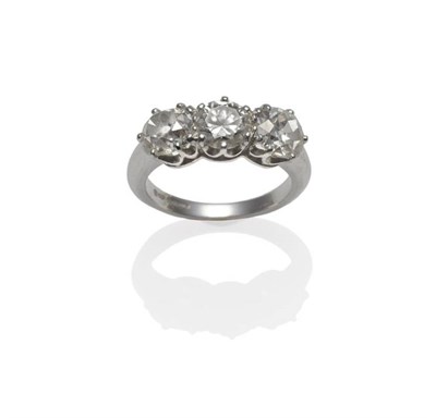 Lot 236 - An 18 Carat White Gold Diamond Three Stone Ring, an old brilliant cut diamond centres two old...