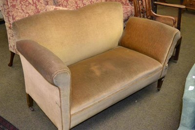 Lot 596 - An Edwardian drop-end settee, upholstered in yellow velvet, on square tapering legs with brass toes