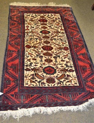 Lot 605 - Balouch rug, Persian/Afghan Frontier, the sand field with a column of flowerheads surrounded by...