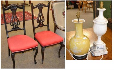 Lot 609 - Two Edwardian side chairs, alabaster pedestal table lamp and pottery lamp (4)