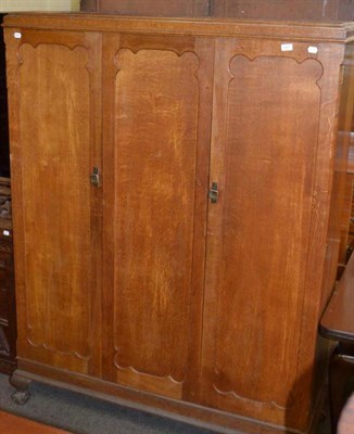 Lot 622 - Cotswold school oak triple wardrobe