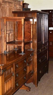 Lot 630 - A mahogany linen press with two cupboard doors below an arrangement of three drawers and also a...