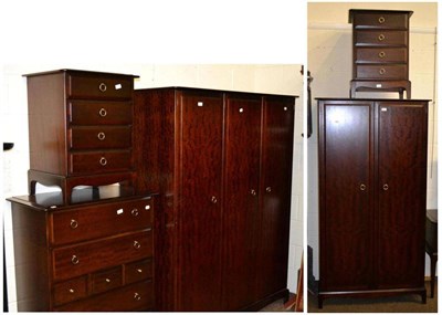 Lot 634 - A Stag Minstrel bedroom suite comprising of triple wardrobe, double wardrobe and pair of...