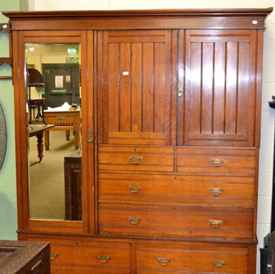 Lot 636 - An Edwardian walnut triple wardrobe