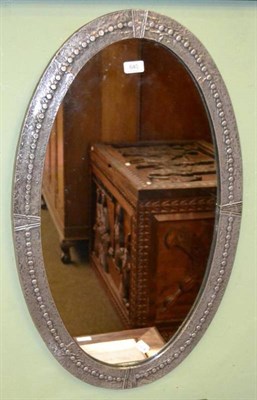 Lot 640 - Oval pewter framed wall mirror