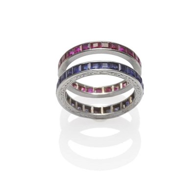 Lot 241 - A Ruby Eternity Ring, step cut rubies in a white channel setting, finger size N, and A Sapphire...