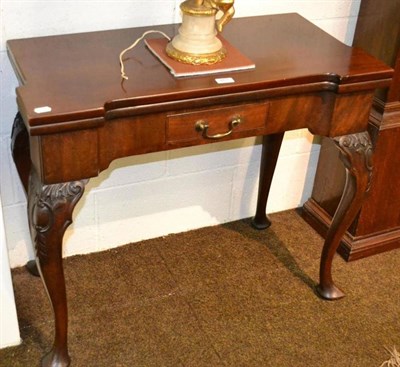 Lot 651 - 19th century mahogany fold over table