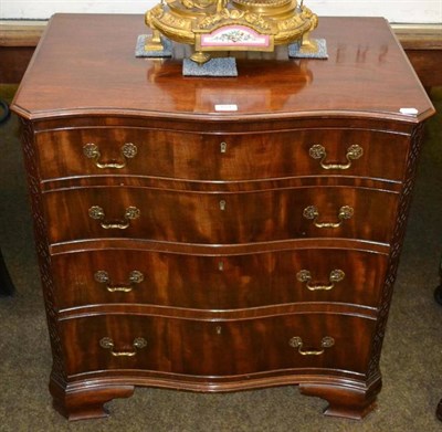 Lot 654 - Serpentine mahogany four height chest of drawers