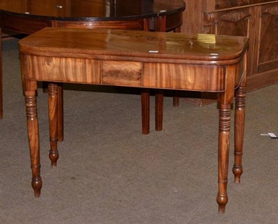 Lot 661 - Early 19th century mahogany fold over tea table