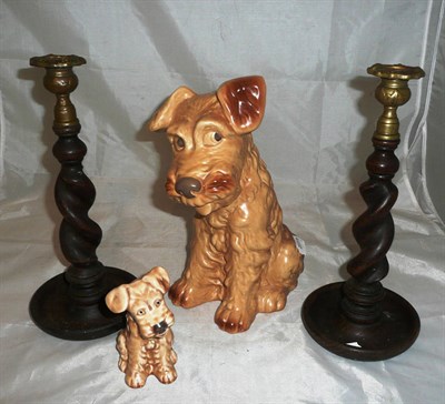 Lot 3 - Two Sylvac pottery seated terriers and a pair of oak barley twist candlesticks