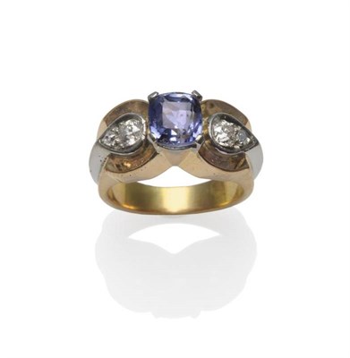 Lot 256 - A Sapphire and Diamond Ring, circa 1940, a cushion cut light blue sapphire in a white claw setting