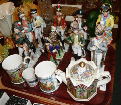 Lot 8 - Ten Continental porcelain military figures, a beaker, two mugs and a teapot (14)