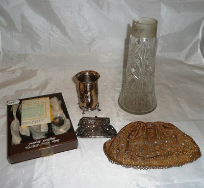 Lot 10 - Silver cherub head bottle holder, cut glass claret jug body, beadwork handbag and purse and a...