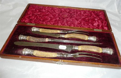 Lot 32 - A Victorian silver mounted cased carving set