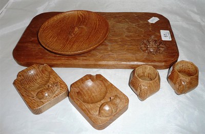 Lot 61 - Pair of Mouseman napkin rings, two Mouseman ashtrays, Mouseman bowl and a Yorkshire School oak...