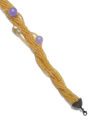 Lot 262 - A Yellow Sapphire, Lavender Jade and South Sea Pearl Torsade, multi strands of facetted yellow...