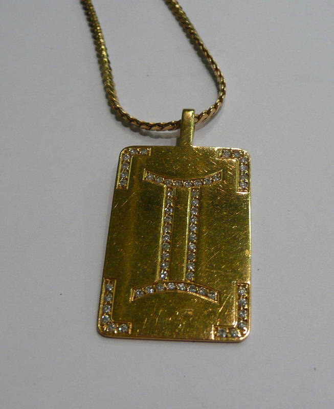 Lot 79 - A diamond set 'Gemini' pendant on chain