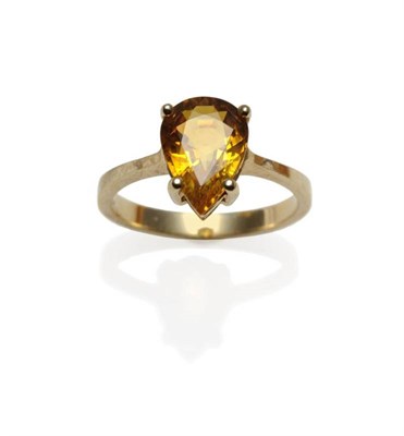 Lot 264 - A Yellow Sapphire Ring, the orangey-yellow pear cut sapphire in a yellow four claw setting, to...