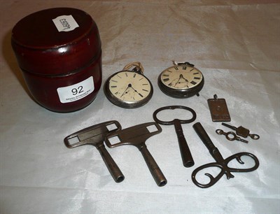 Lot 92 - Two silver pocket watches, four watch keys, four clock keys, a silver ingot pendant and a...